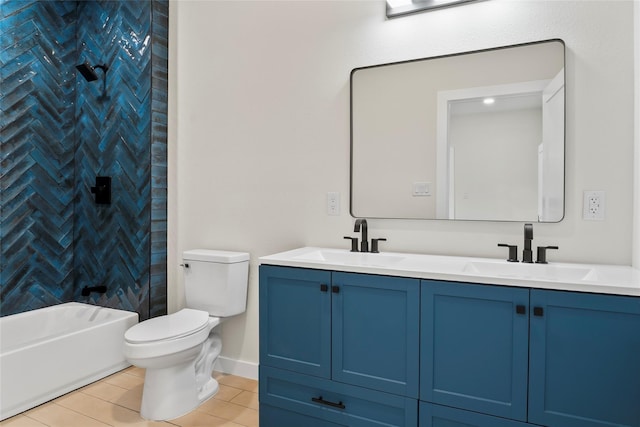 full bathroom featuring vanity, tiled shower / bath, and toilet