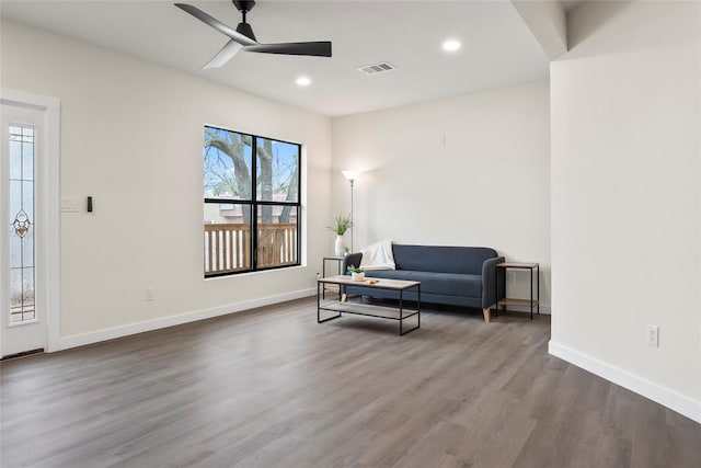 sitting room featuring ceiling fan and dark hardwood / wood-style floors