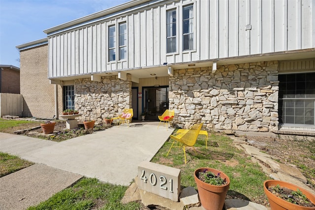 doorway to property with a patio area