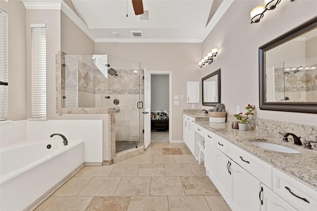 ensuite bathroom featuring double vanity, visible vents, a garden tub, crown molding, and a sink