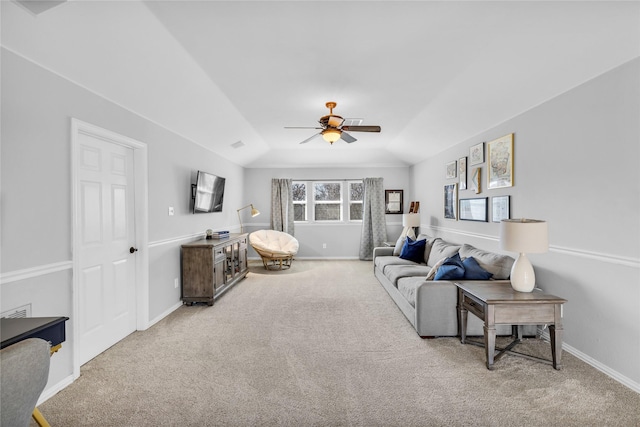 living room featuring light carpet, ceiling fan, baseboards, and lofted ceiling