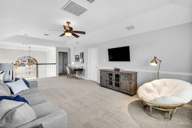 living room featuring light carpet, vaulted ceiling, visible vents, and a ceiling fan