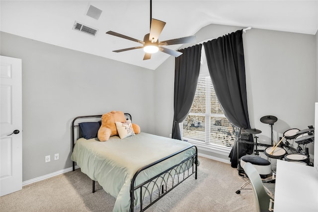 bedroom with lofted ceiling, baseboards, visible vents, and light colored carpet