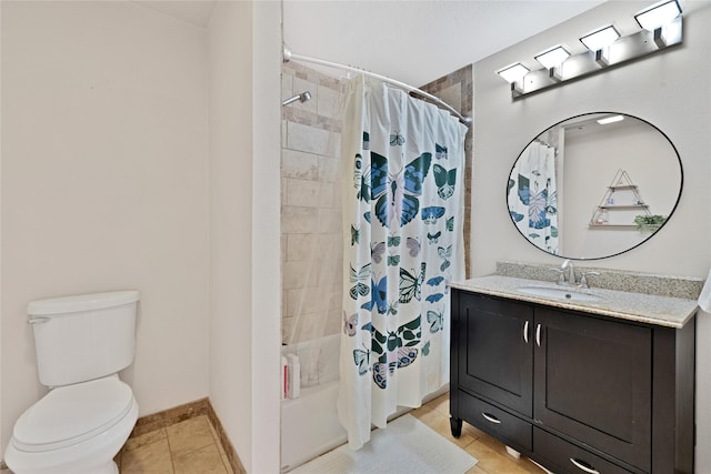 bathroom featuring tile patterned flooring, toilet, shower / tub combo, vanity, and baseboards