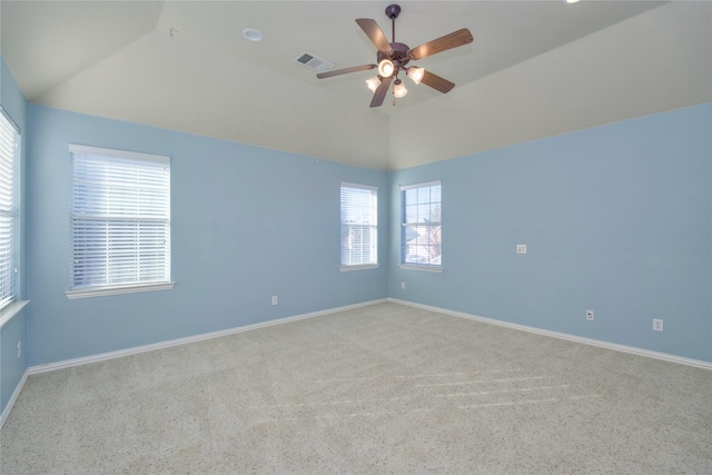 carpeted empty room with lofted ceiling and ceiling fan