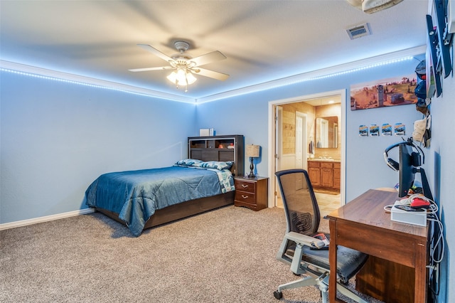 carpeted bedroom featuring ensuite bathroom and ceiling fan