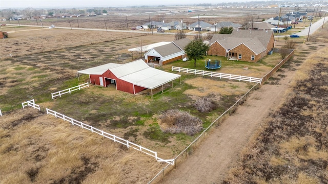 birds eye view of property with a rural view