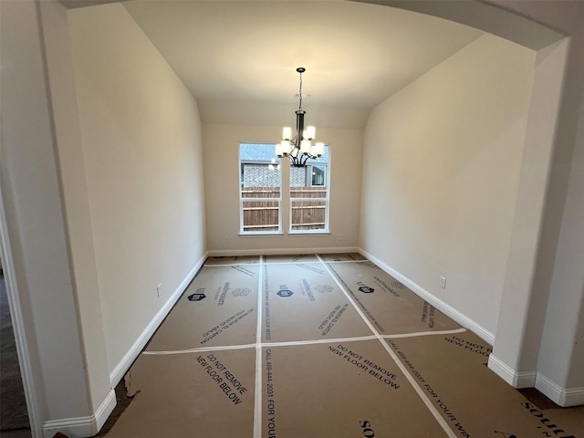 unfurnished dining area with an inviting chandelier