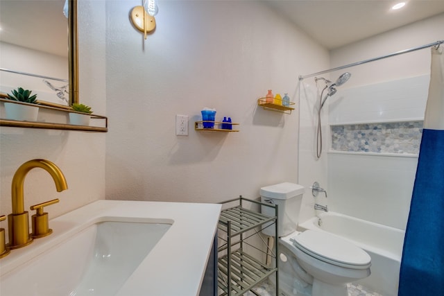 full bathroom featuring sink, toilet, and shower / bath combo with shower curtain