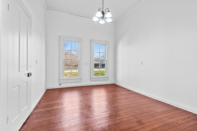 interior space with hardwood / wood-style flooring and a notable chandelier