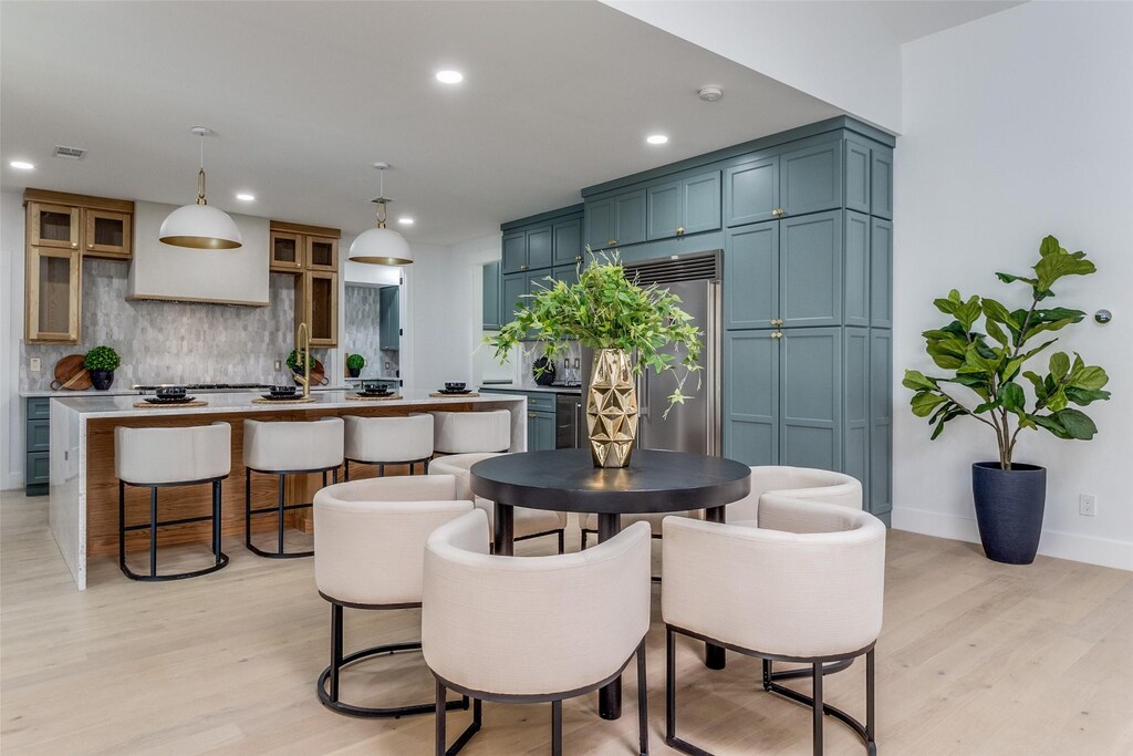 7024 Lupton Dr, Dallas, TX 75225 - dining area featuring light hardwood / wood-style flooring