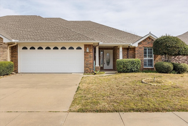 ranch-style house with a garage, concrete driveway, brick siding, and a shingled roof