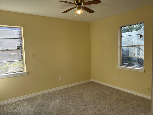 unfurnished room with carpet and ceiling fan