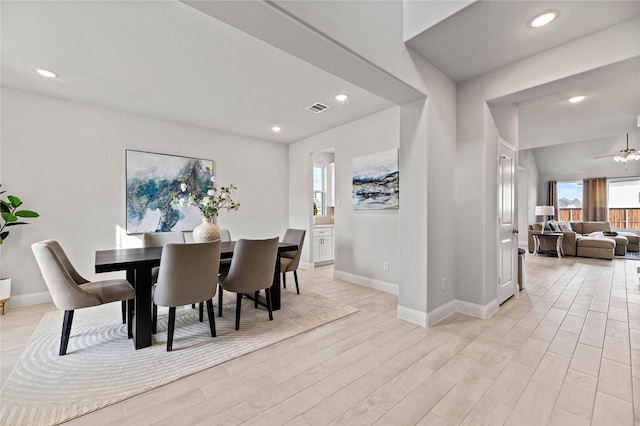 dining space with light wood-type flooring