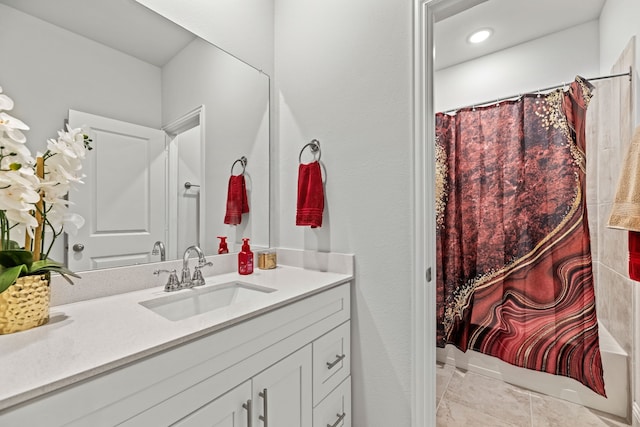 bathroom with recessed lighting, curtained shower, and vanity