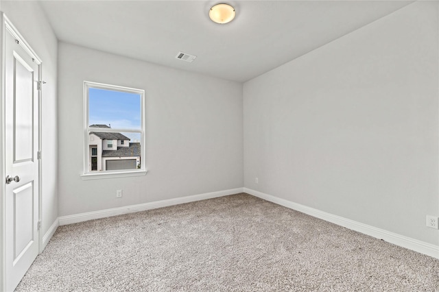 unfurnished room featuring visible vents, baseboards, and carpet floors