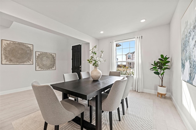 dining space featuring light hardwood / wood-style floors