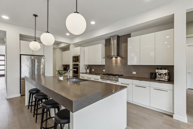4112 Heatherton Dr, Celina, TX 75009 - kitchen with wall chimney exhaust hood, a sink, dark countertops, stainless steel appliances, and recessed lighting