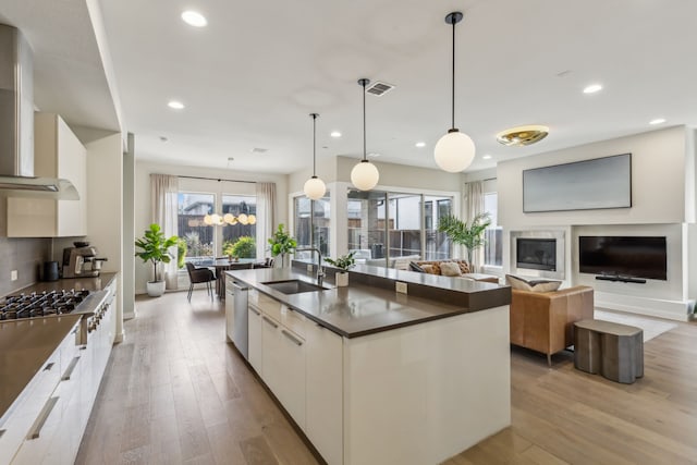 4112 Heatherton Dr, Celina, TX 75009 - kitchen with stainless steel appliances, modern cabinets, a sink, dark countertops, and recessed lighting