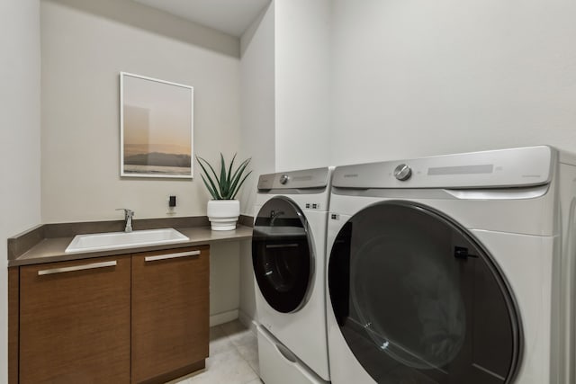 4112 Heatherton Dr, Celina, TX 75009 - laundry area featuring washing machine and dryer, cabinet space, and light tile patterned floors