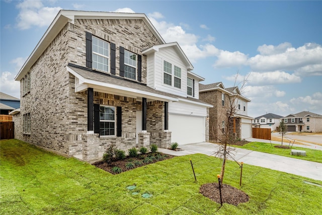 view of front of property featuring a front yard and a garage