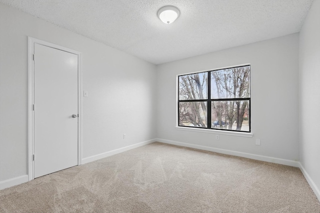 2160 Glenhaven Dr, Lewisville, TX 75067 - carpeted empty room featuring a textured ceiling and baseboards