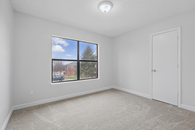 2160 Glenhaven Dr, Lewisville, TX 75067 - spare room featuring carpet floors and a textured ceiling