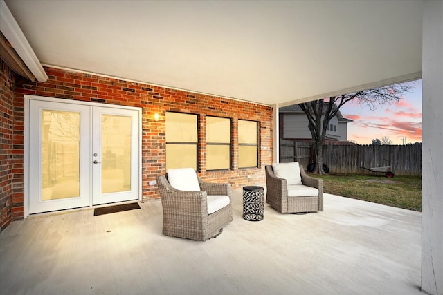 2160 Glenhaven Dr, Lewisville, TX 75067 - patio terrace at dusk featuring a patio area and french doors