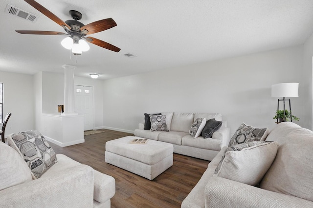 2160 Glenhaven Dr, Lewisville, TX 75067 - living area with wood finished floors, ornate columns, and a ceiling fan