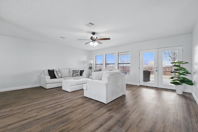 2160 Glenhaven Dr, Lewisville, TX 75067 - living room with french doors, ceiling fan, dark wood finished floors, and a textured ceiling