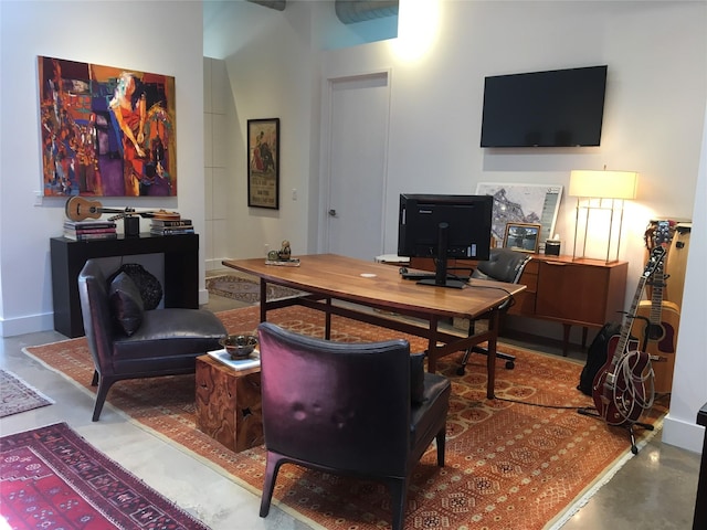 office area with concrete floors