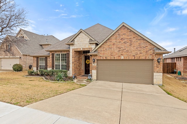 view of front of property featuring an attached garage, brick siding, a shingled roof, concrete driveway, and a front lawn