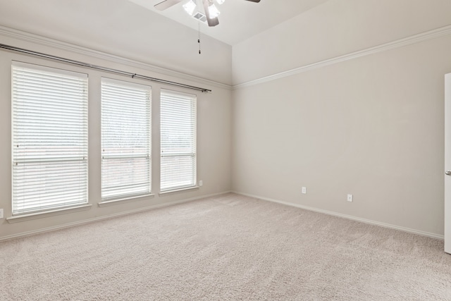 spare room with light carpet, ceiling fan, and vaulted ceiling