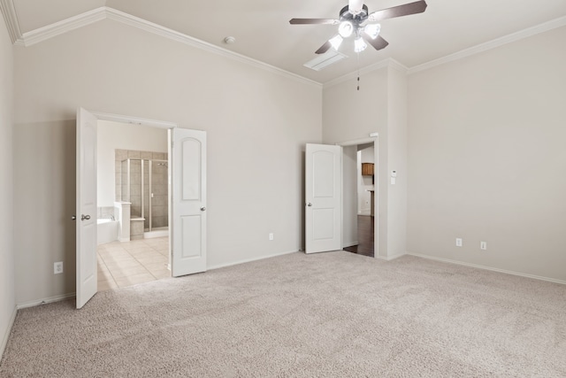 unfurnished bedroom with high vaulted ceiling, connected bathroom, light colored carpet, baseboards, and ornamental molding