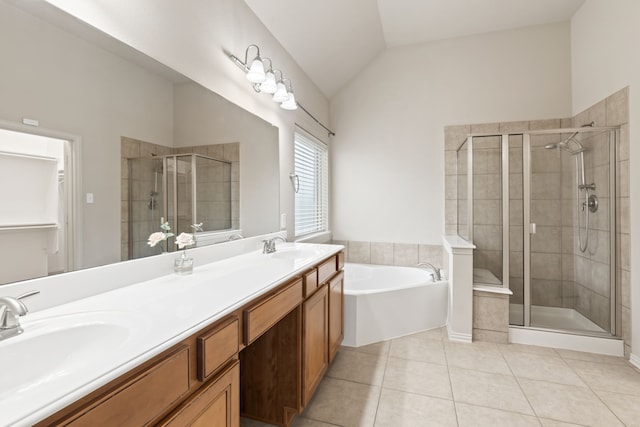 bathroom featuring a shower stall, a sink, lofted ceiling, and tile patterned floors