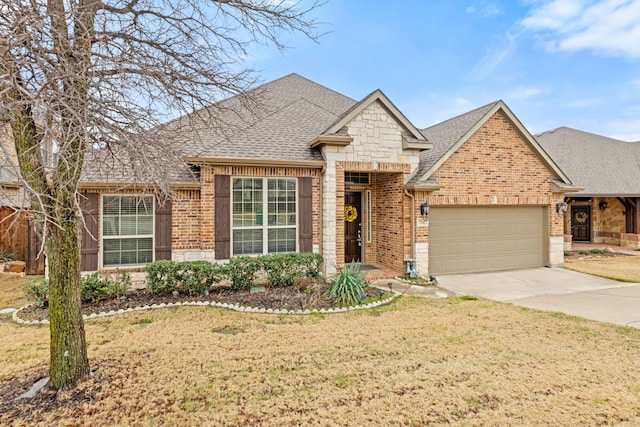 view of front of property with a front lawn, brick siding, an attached garage, and roof with shingles