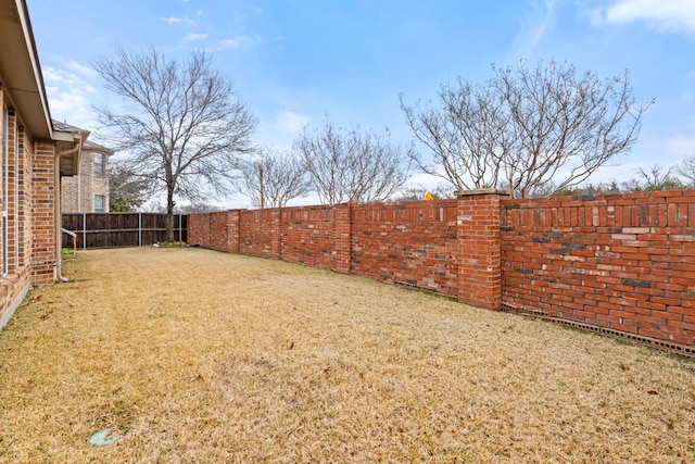 view of yard featuring a fenced backyard