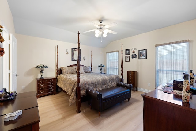 bedroom with light hardwood / wood-style flooring, ceiling fan, and vaulted ceiling