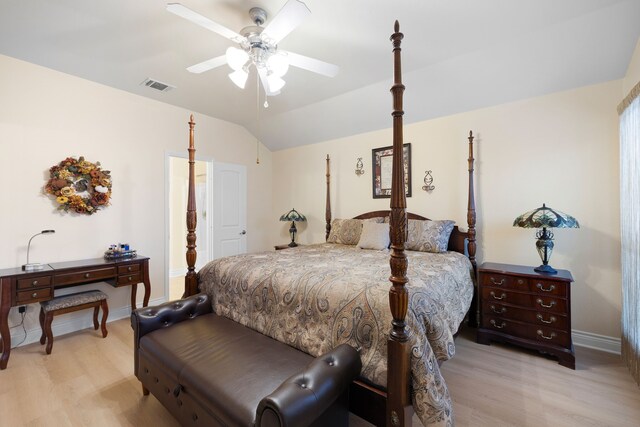 bedroom with ceiling fan, light hardwood / wood-style flooring, and vaulted ceiling