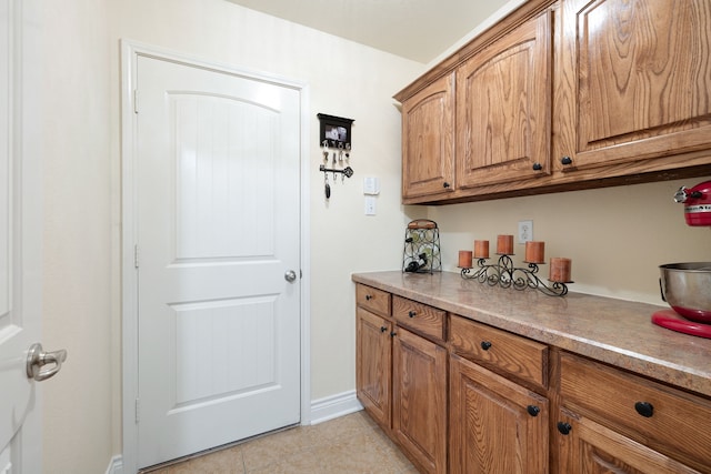 kitchen with light tile patterned flooring