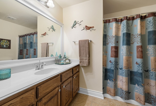 bathroom featuring tile patterned flooring, curtained shower, and vanity
