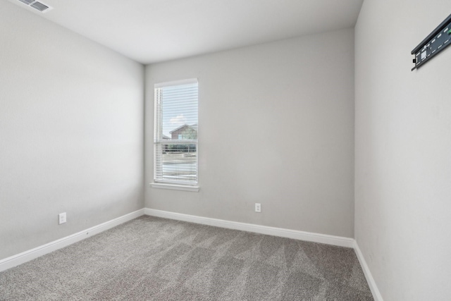 unfurnished room featuring carpet floors