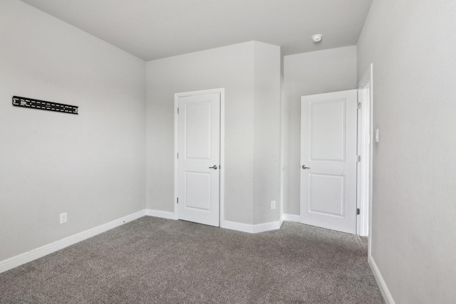 unfurnished bedroom with carpet flooring