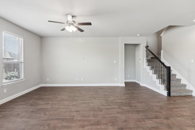 spare room with dark hardwood / wood-style floors and ceiling fan