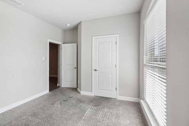 unfurnished bedroom featuring carpet