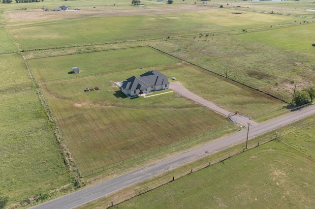 birds eye view of property with a rural view