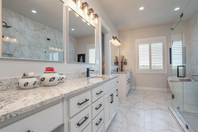 full bathroom featuring vanity, marble finish floor, a stall shower, and recessed lighting