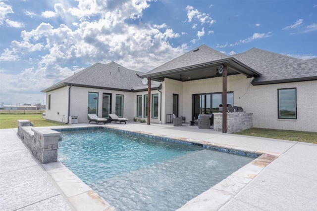 pool featuring ceiling fan and a patio area