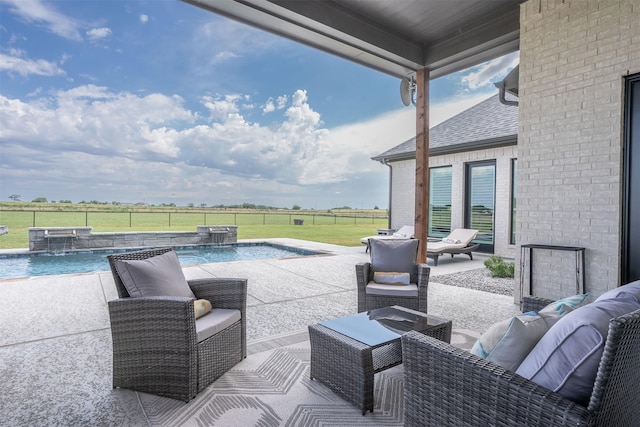 view of patio / terrace featuring fence, a jacuzzi, outdoor lounge area, and a fenced in pool