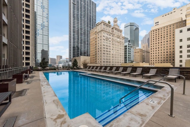 view of swimming pool with a patio area